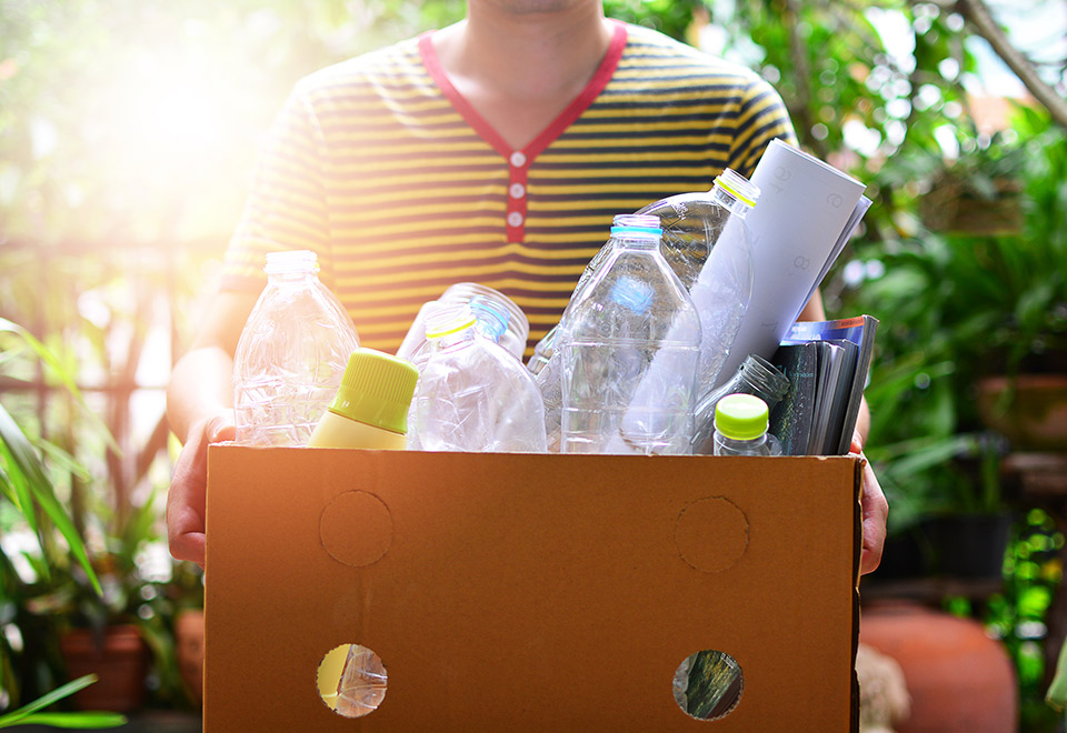Image of person recycling